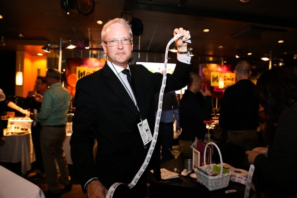 Person holding tickets at 2015 Raise Your Glasses event