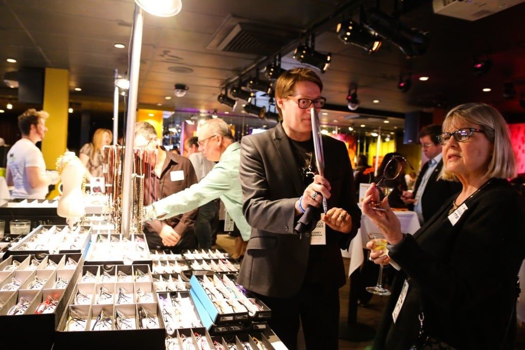 Vendor helping customer at 2015 Raise Your Glasses event