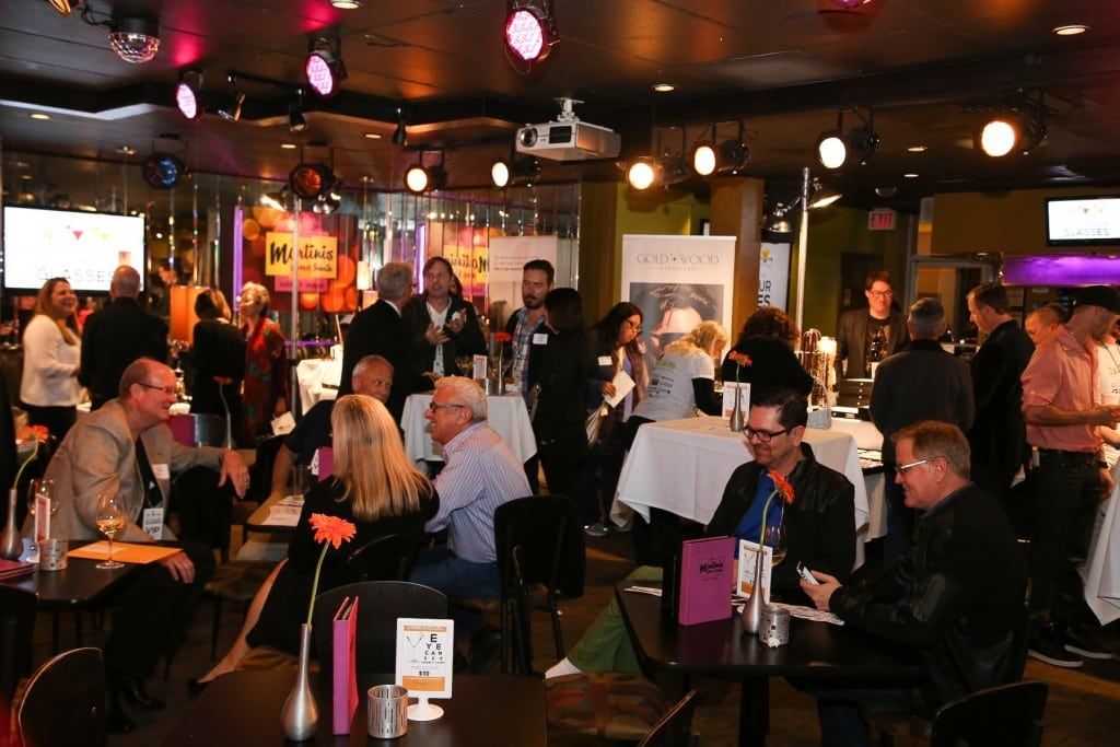 Many people enjoying the 2015 Raise Your Glasses event