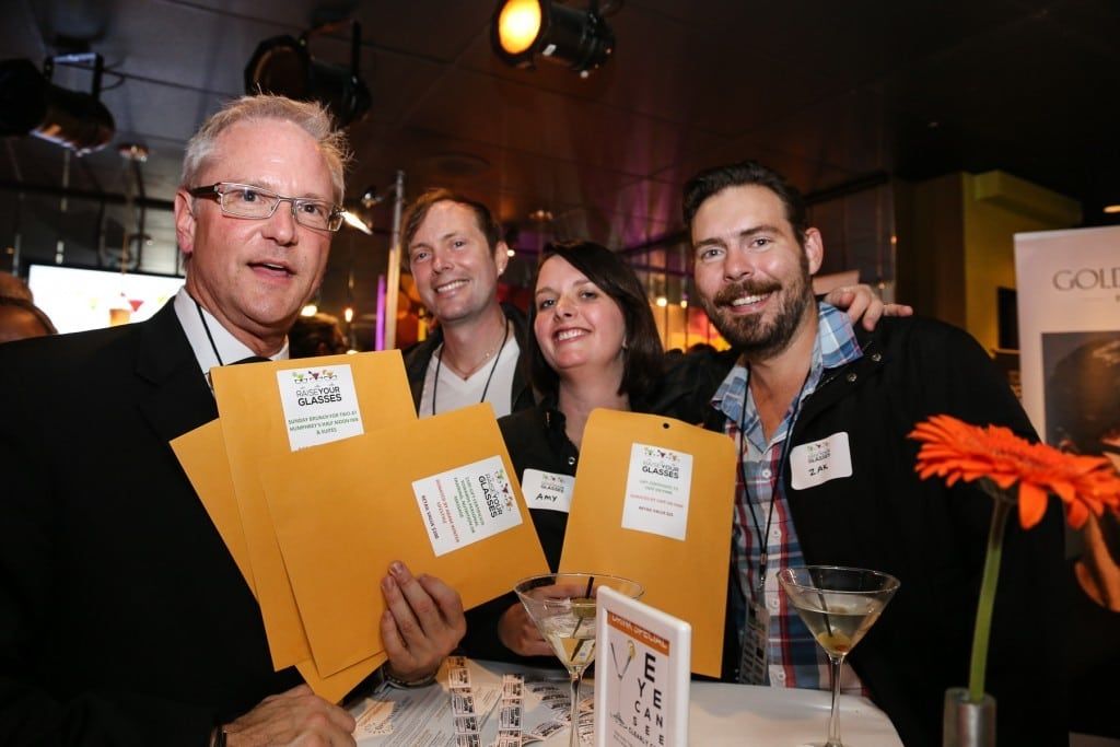4 people smiling for the camera at 2015 Raise Your Glasses event