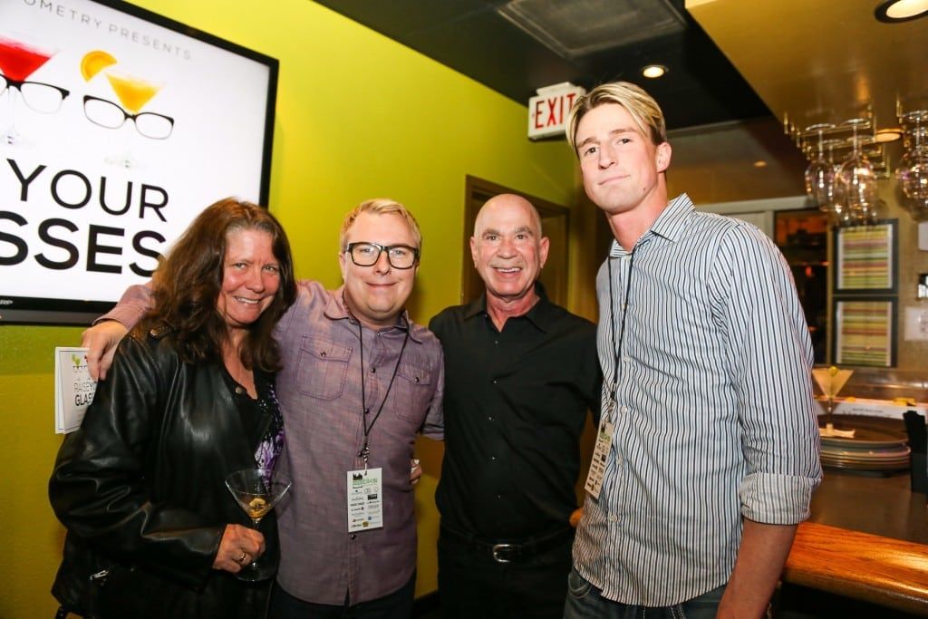 4 people standing inside at Martinis Above Fourth at 2015 Raise Your Glasses event