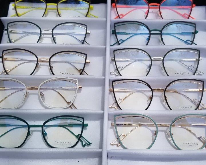Eyeglass frames in white display boxes at 2019 Raise Your Glasses Event