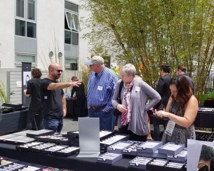3 people chatting outside at Urban Optiks Optometry 2019 Raise Your Glasses Event
