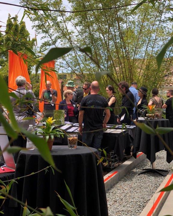 Many people standing outside enjoying  Raise Your Glasses 2019 Event