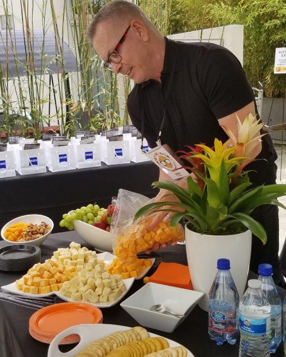 Person working at appetizers table at 2019 Raise Your Glasses Event
