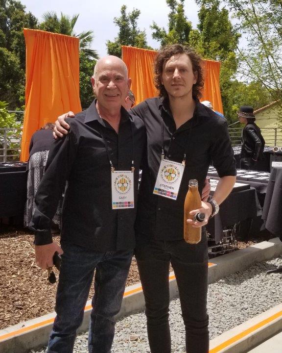 Dr Klein and vendor posing at Urban Optiks Optometry  2019 Raise Your Glasses Event