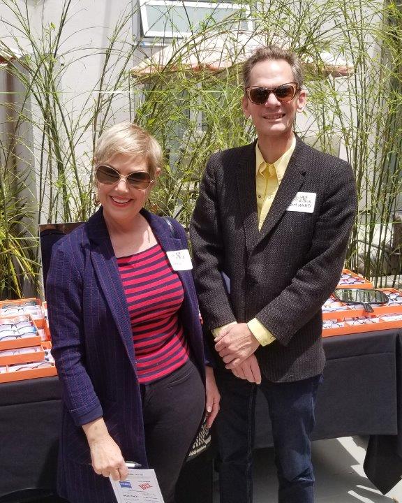 2 guests wearing sunglasses standing outside at Raise Your Glasses 2019 Event