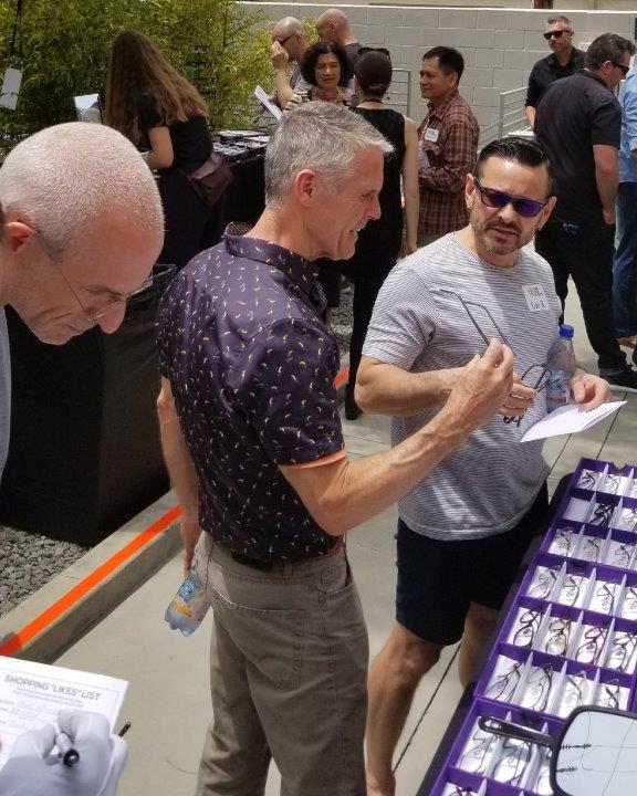 3 guests admiring frame lines at Raise Your Glasses 2019 Event