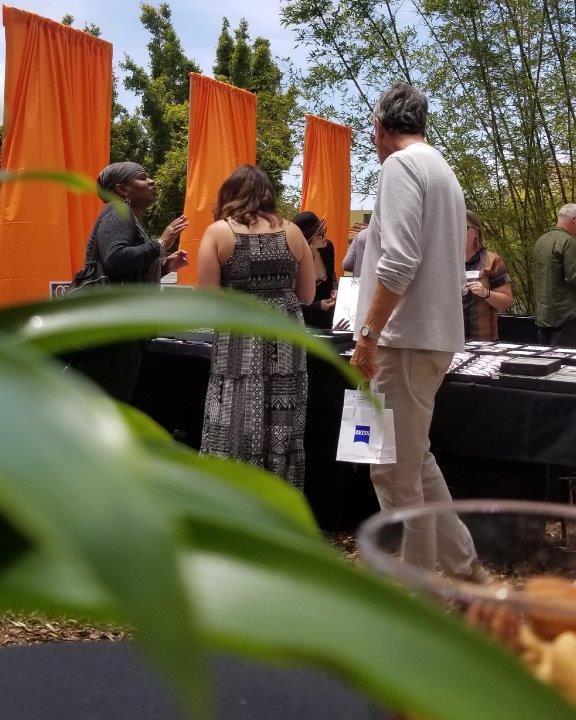 View of two guests looking at framelines at Raise Your Glasses 2019 Event