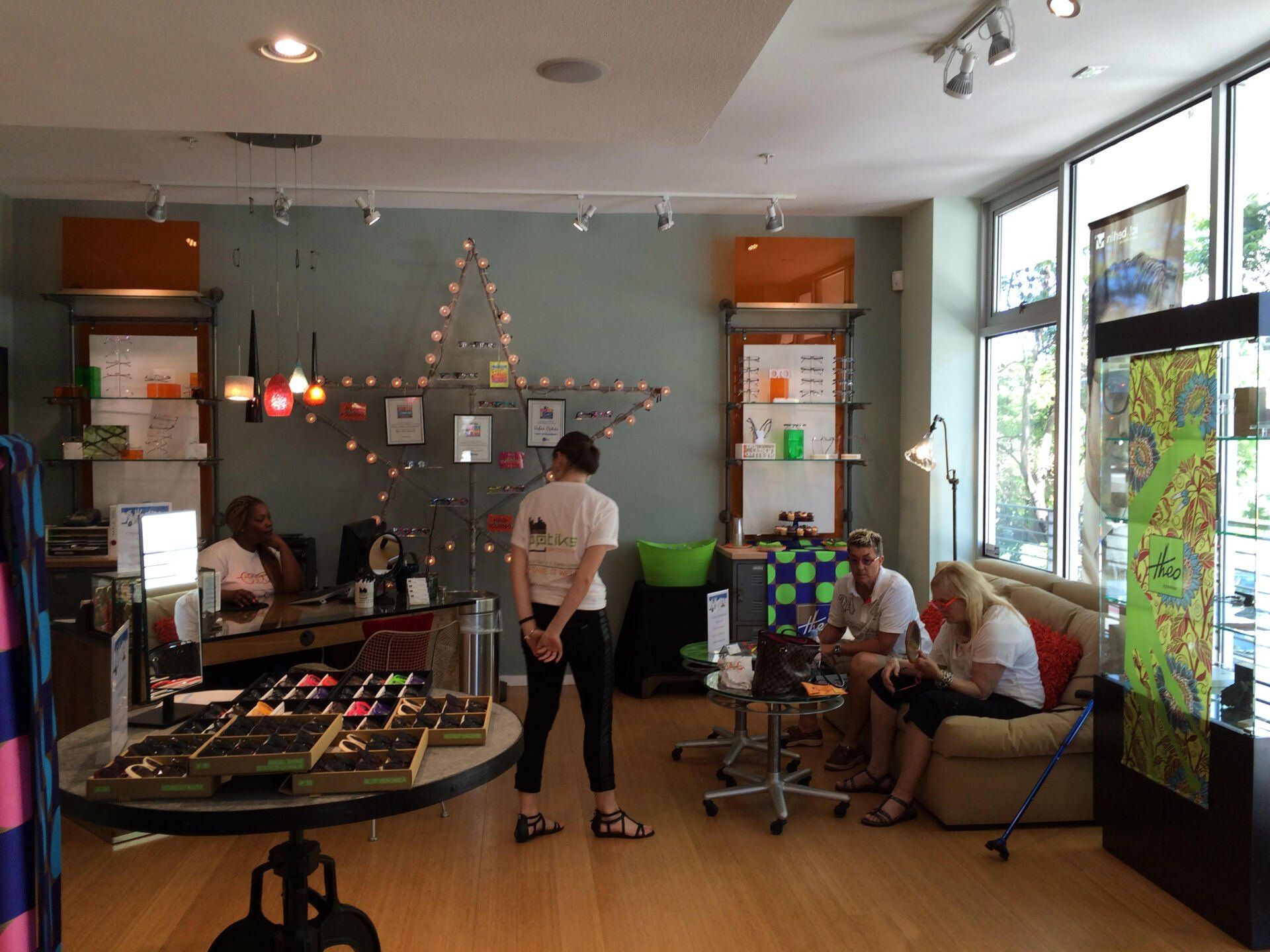 People inside Urban Optiks Optometry at 2016 Theo Trunk Show Event
