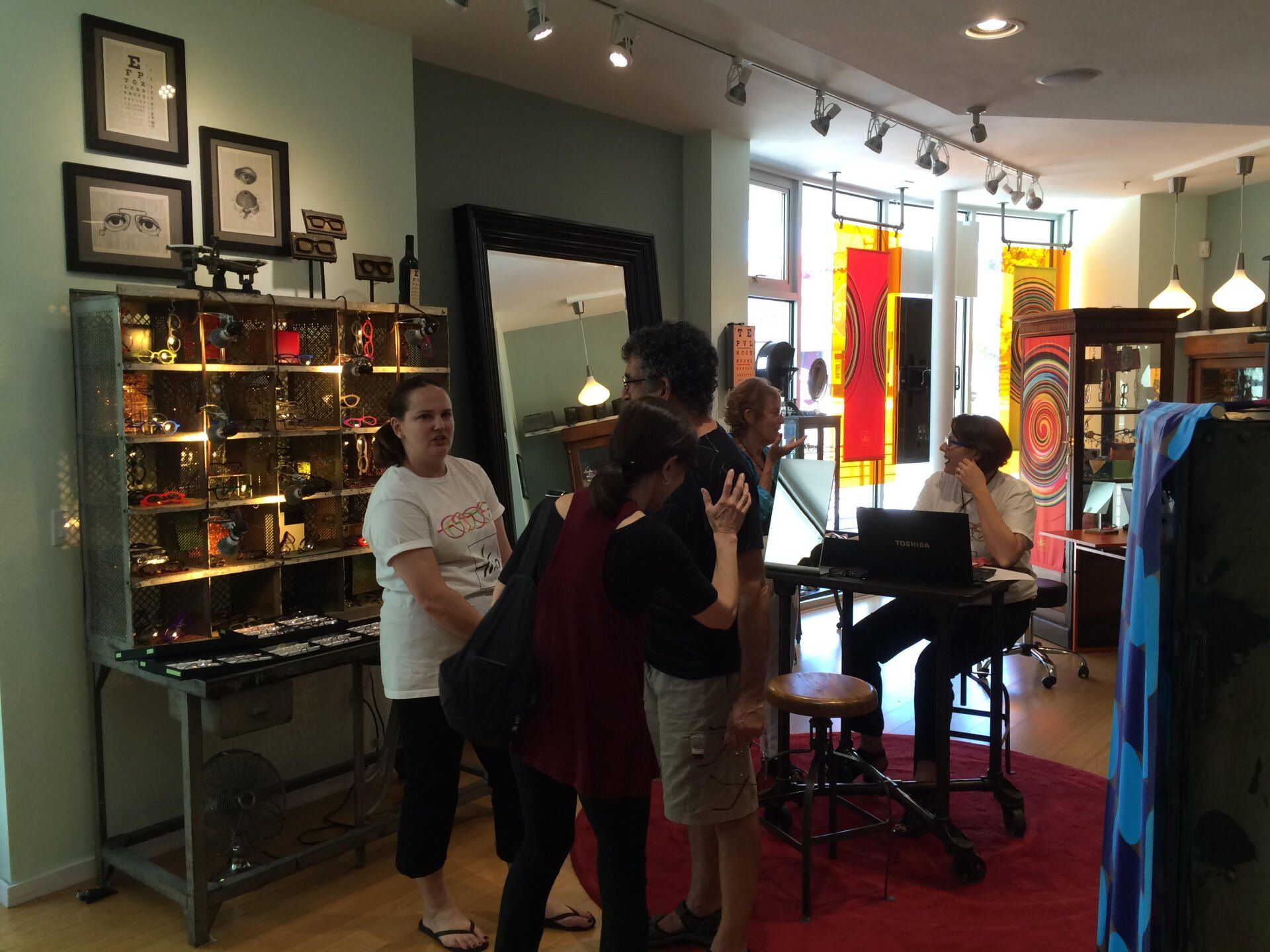 More people talking to vendor at 2016 Theo Trunk Show Event