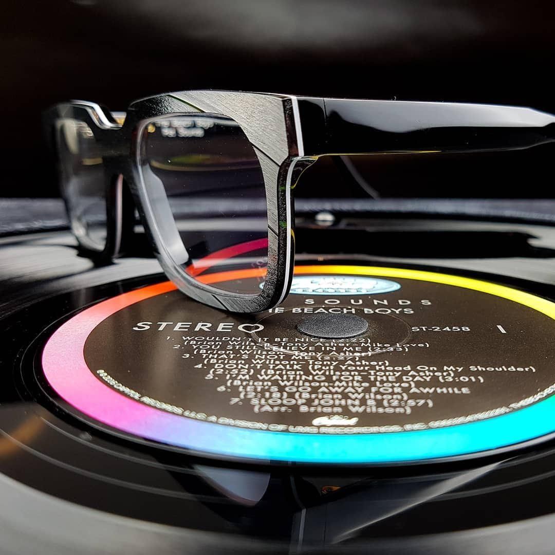 Two Vinylize frames sitting on a record album