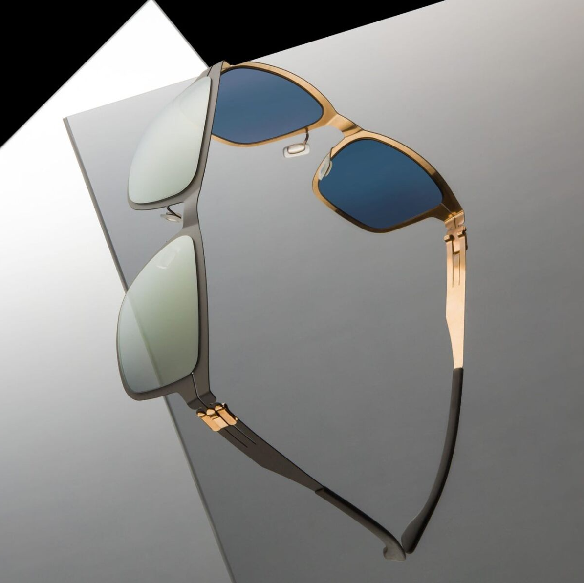 Two ic Berlin! sunglasses in gun metal gray an bright gold
