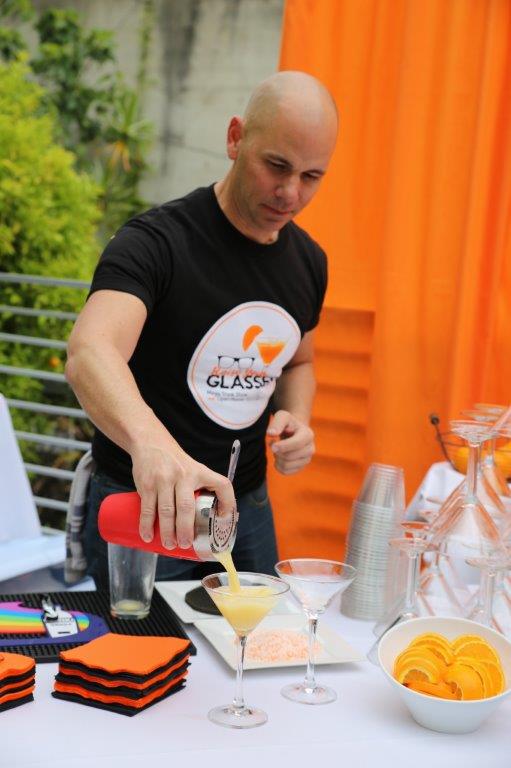 Person pouring a martini at Raise Your Glasses 2017 Event