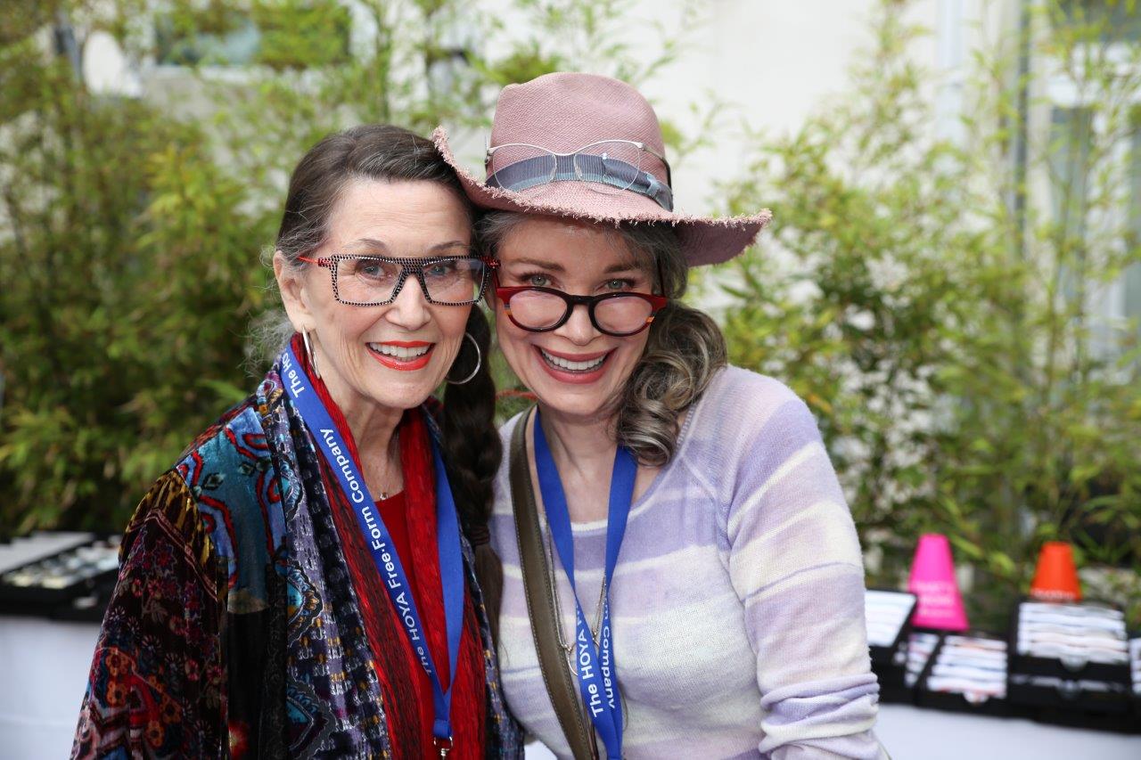 2 smiling people in glasses posing at Raise Your Glasses 2017 Event