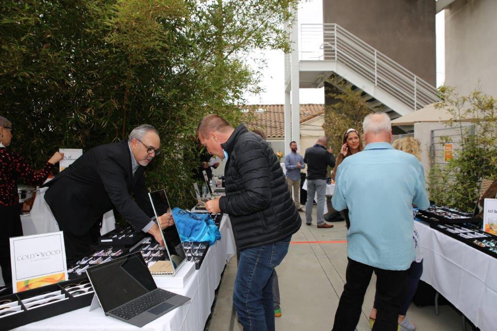 People at another vendor table at Raise Your Glasses 2017 Event