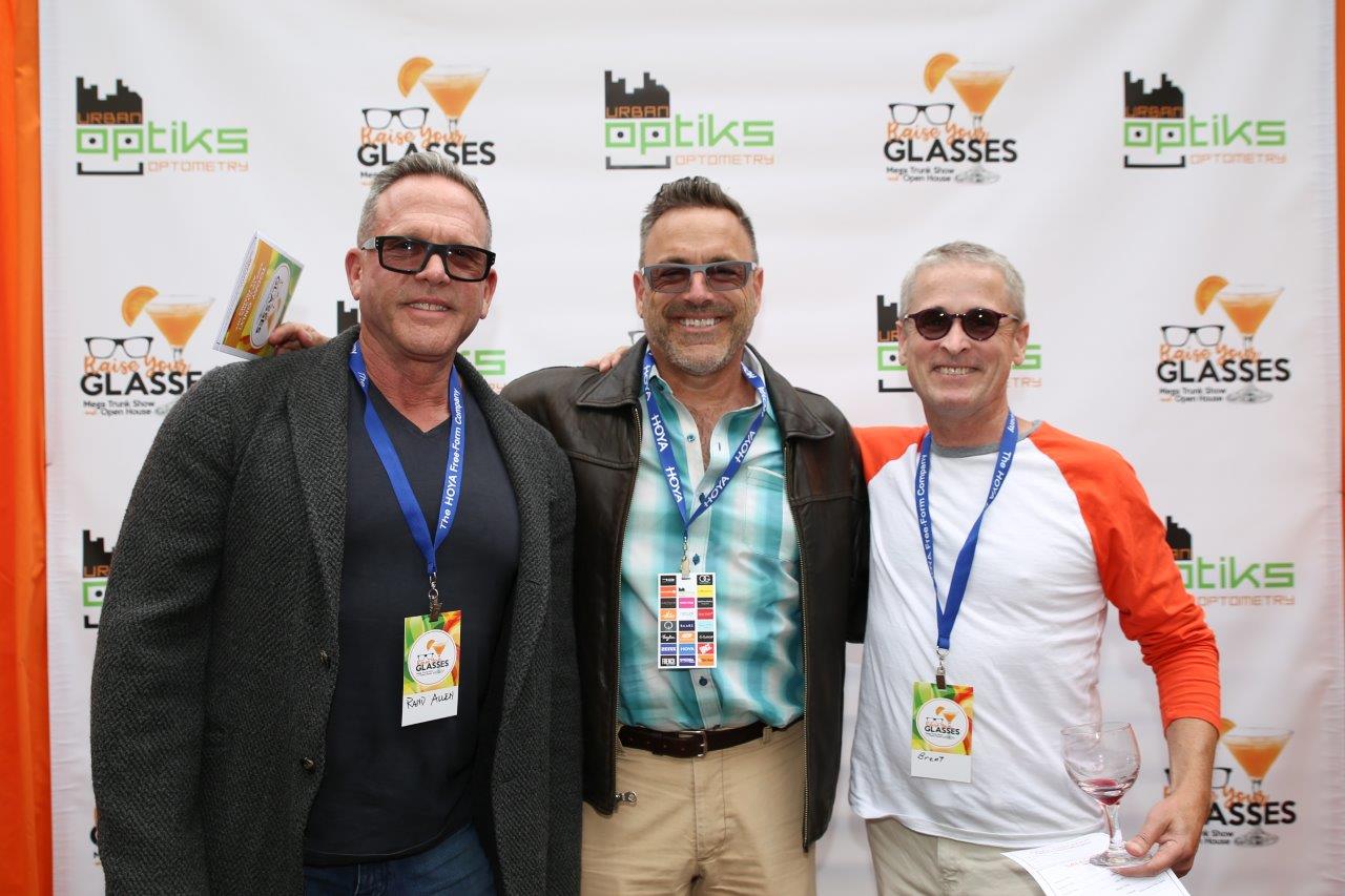 3 smiling people enjoying Raise Your Glasses 2017 Event