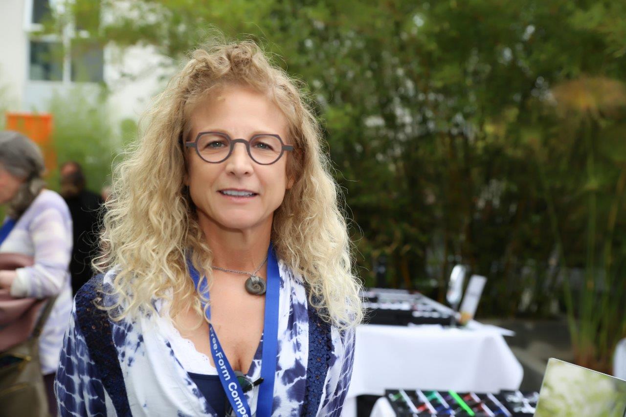 Person trying on glasses at Raise Your Glasses 2017 Event