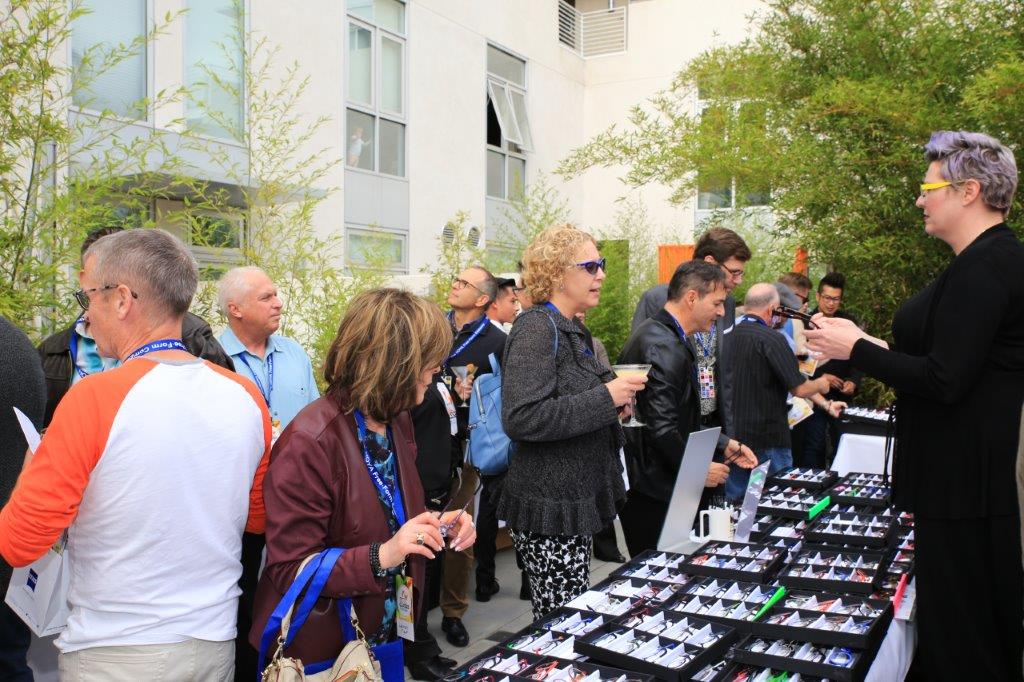 Many people looking at frameline displays at Raise Your Glasses 2017 Event