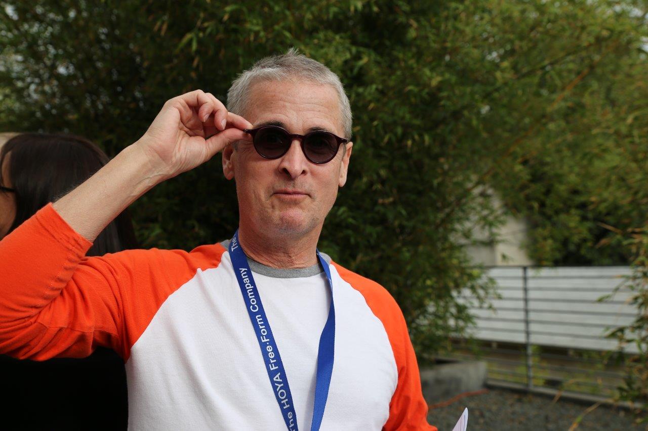 Person trying on sunglass frames at Raise Your Glasses 2017 Event