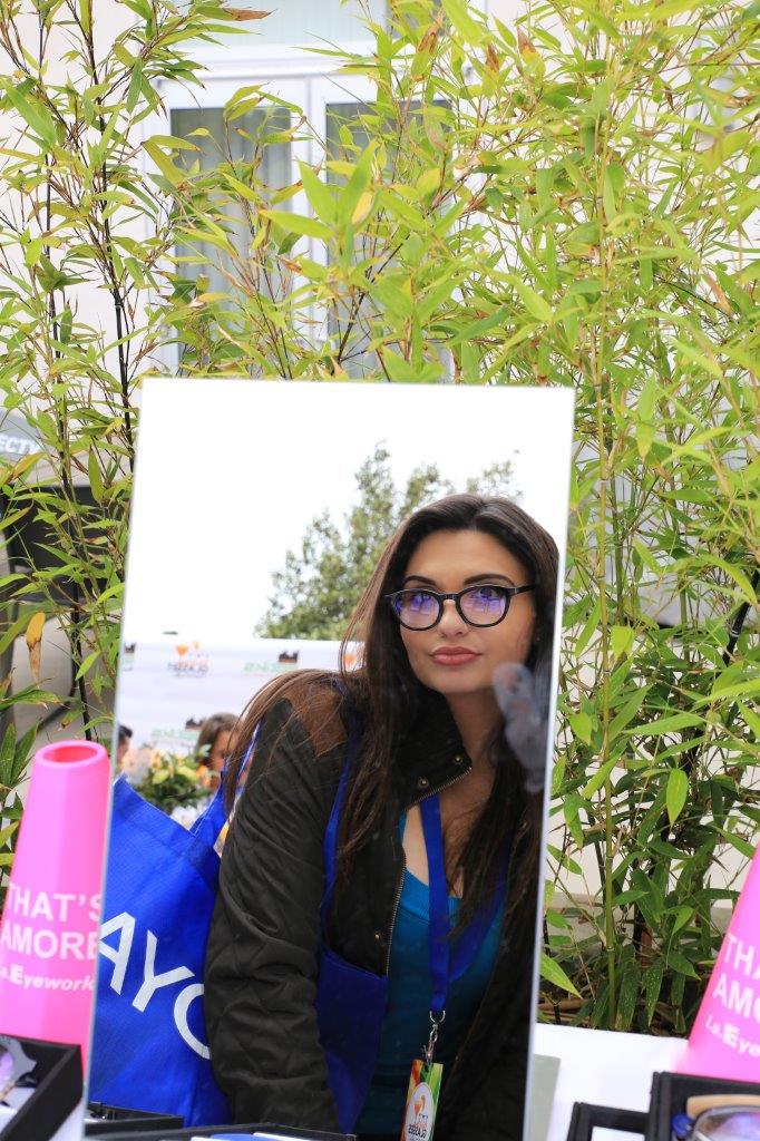 Person trying on frames at Raise Your Glasses 2017 Event