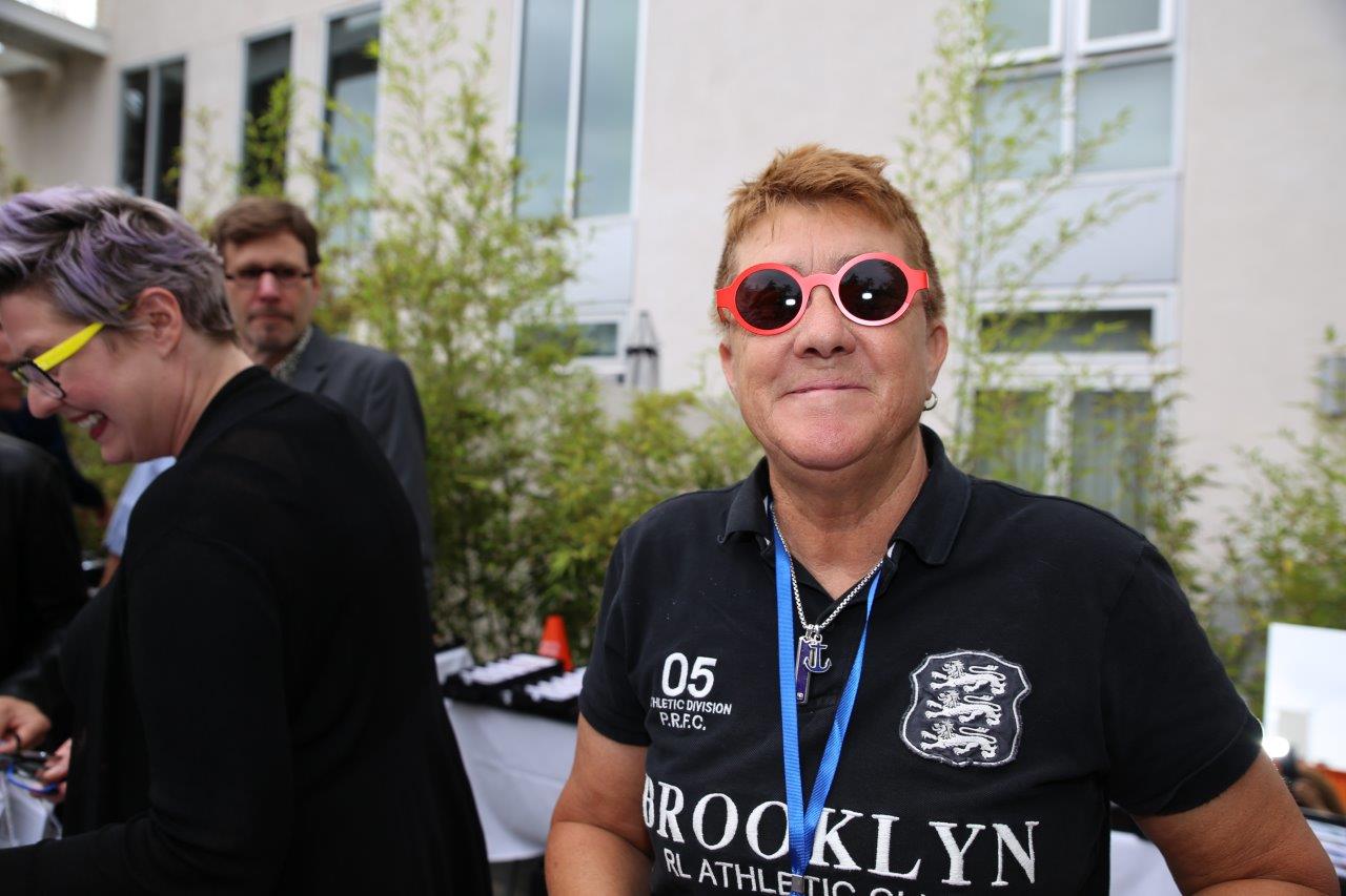 Person modeling bright orange frames at Raise Your Glasses 2017 Event