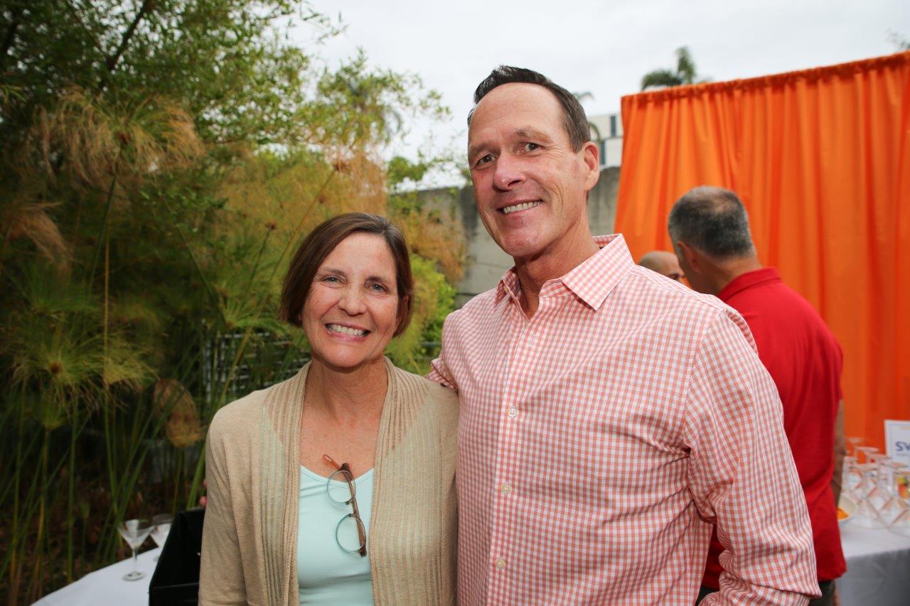 2 people smiling for camera at Raise Your Glasses 2017