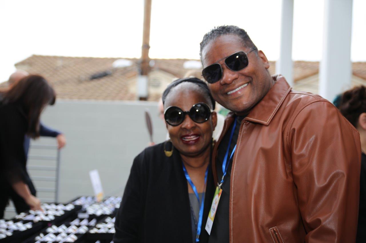 2 people wearing sunglasses at Raise Your Glasses 2017
