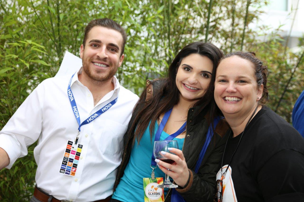 3 people smiling and posing at Raise Your Glasses 2017 Event