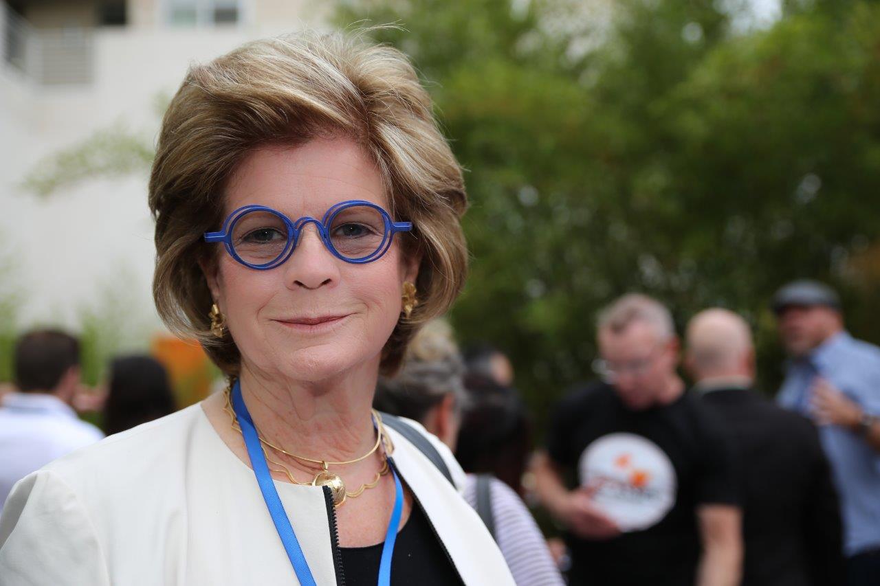Person modeling blue frames at Raise Your Glasses 2017 Event