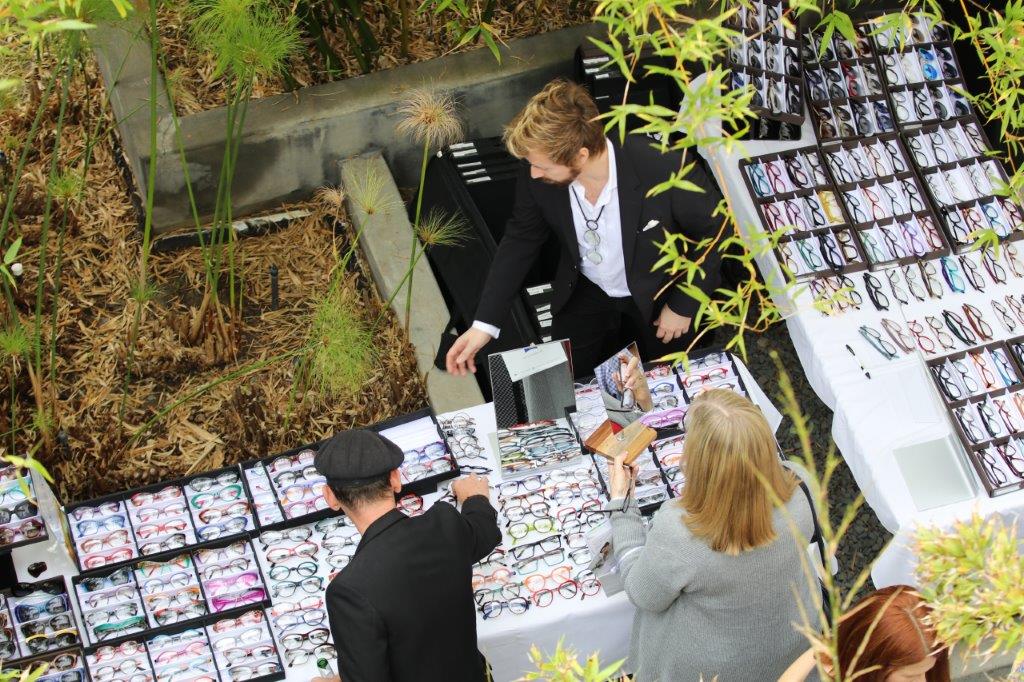 Vendor and customers at table at Raise Your Glasses 2017 Event