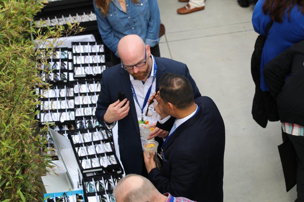 View from above of 2 people talking at Raise Your Glasses 2017 Event
