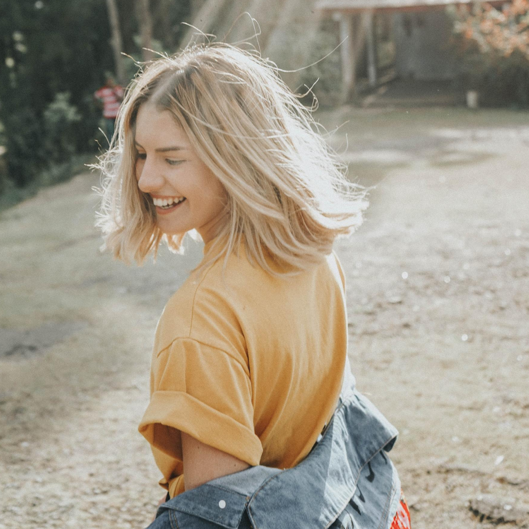 Smiling woman standing outside
