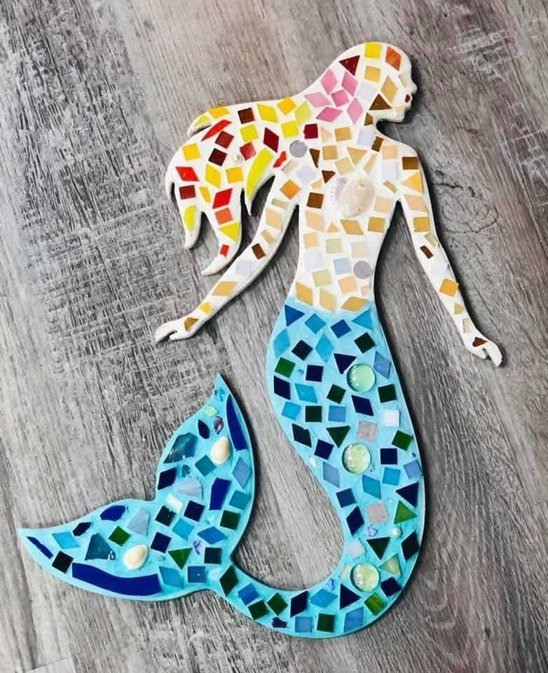 Mosaic-style mermaid with a blue tail and multicolored top on a gray textured background