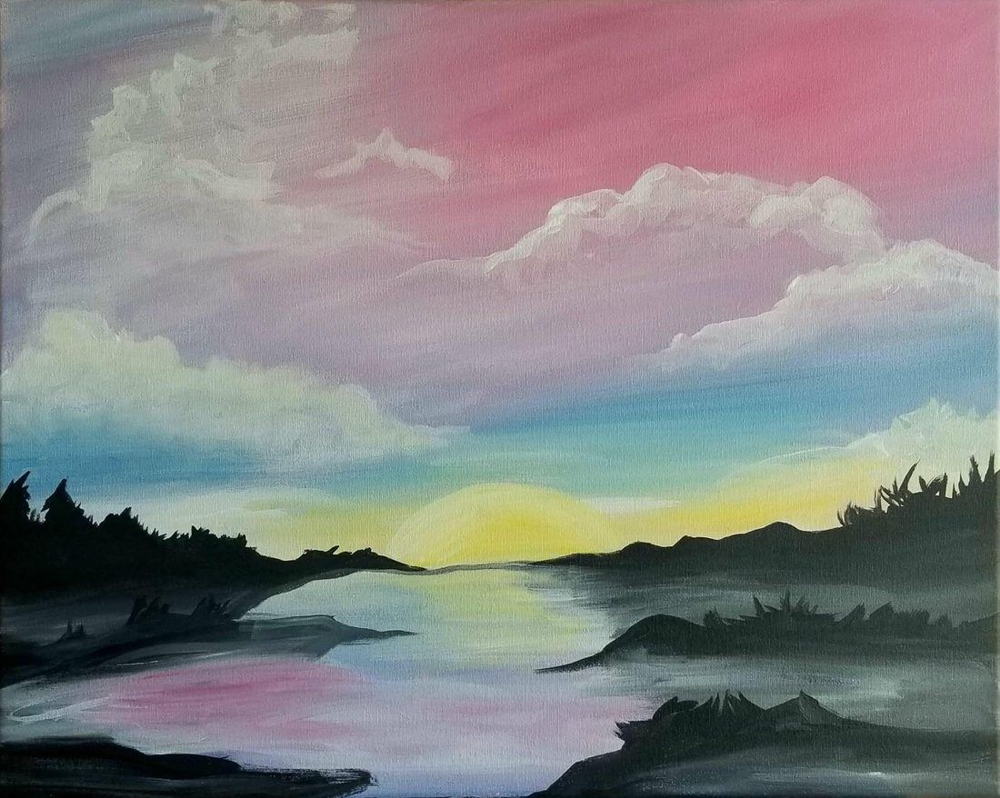 Pastel sunset over calm water with silhouetted trees and clouds