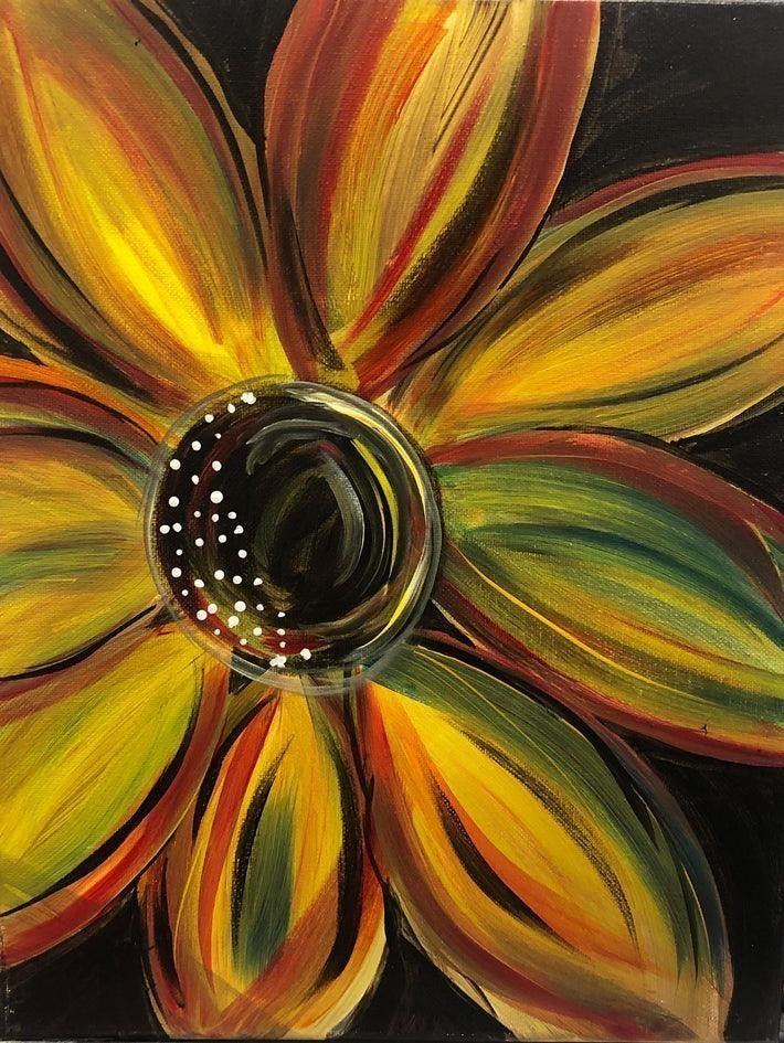 Abstract flower painting with yellow, orange, and red petals around a dark center on a black background