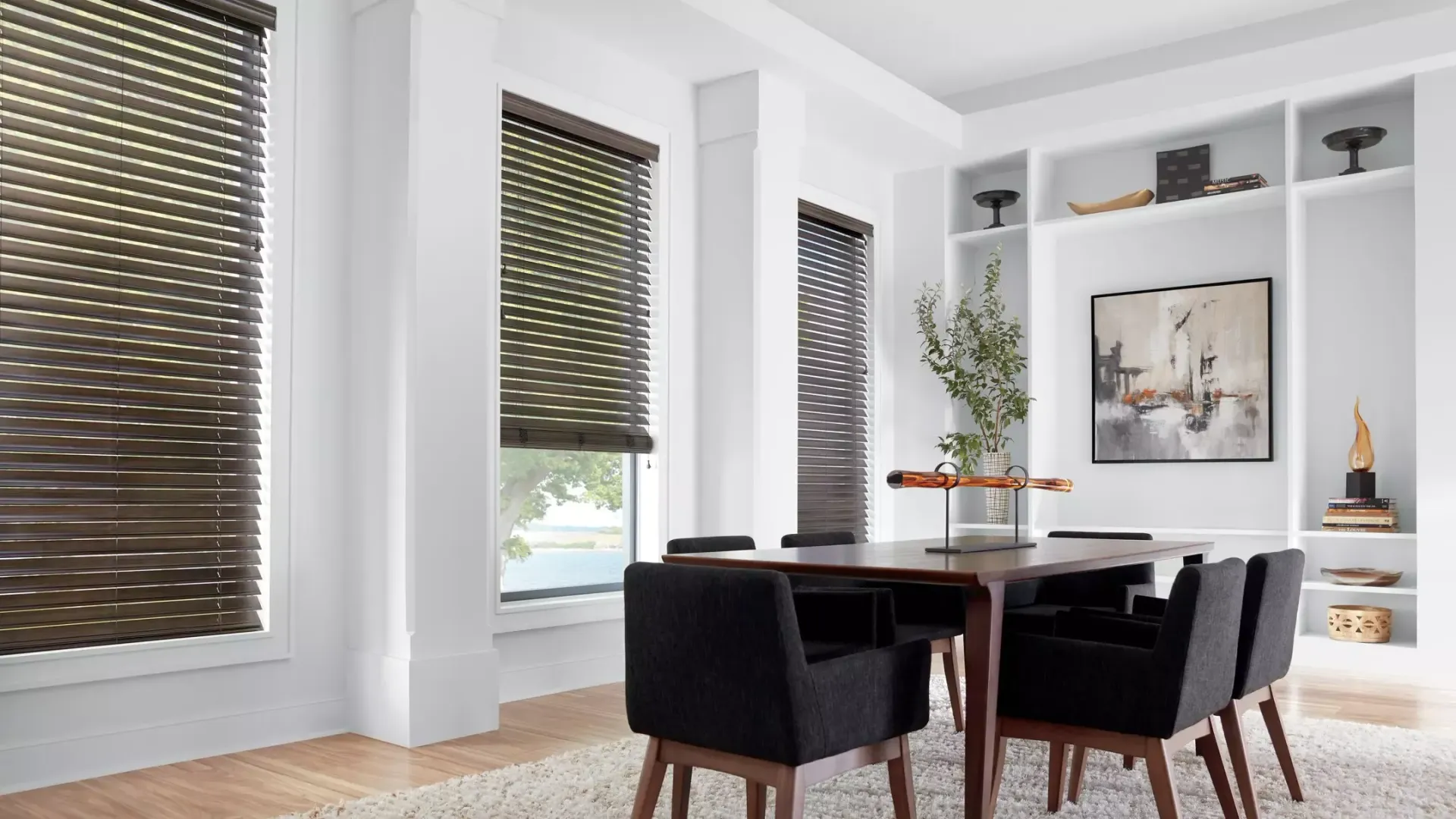 Hunter Douglas EverWood® Faux Wood Blinds in white dining room with built in shelves