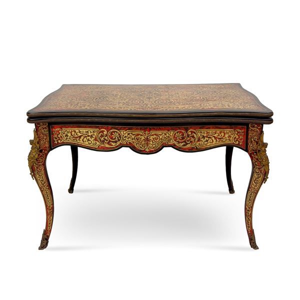 Tavolo da gioco in legno ebanizzato decorato alla maniera di Boulle, Francia XIX secolo.