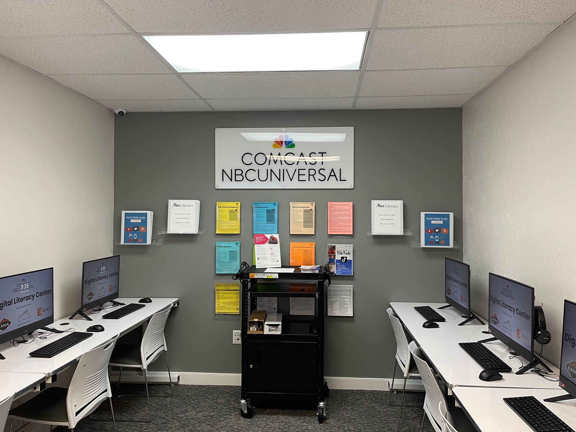 A computer lab with a sign that says nbc universal
