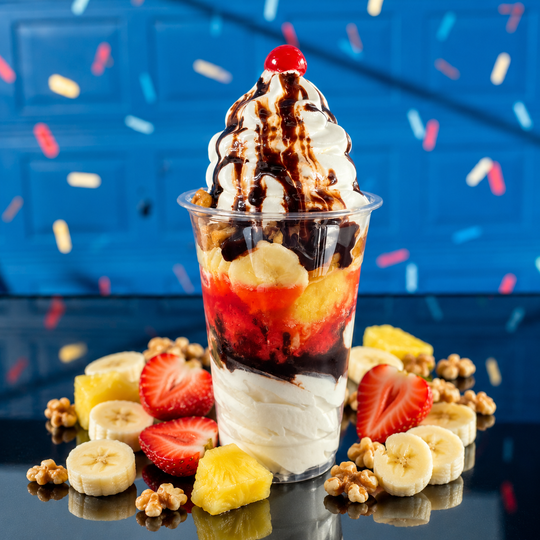 a close up of a sundae in a cup on a table .