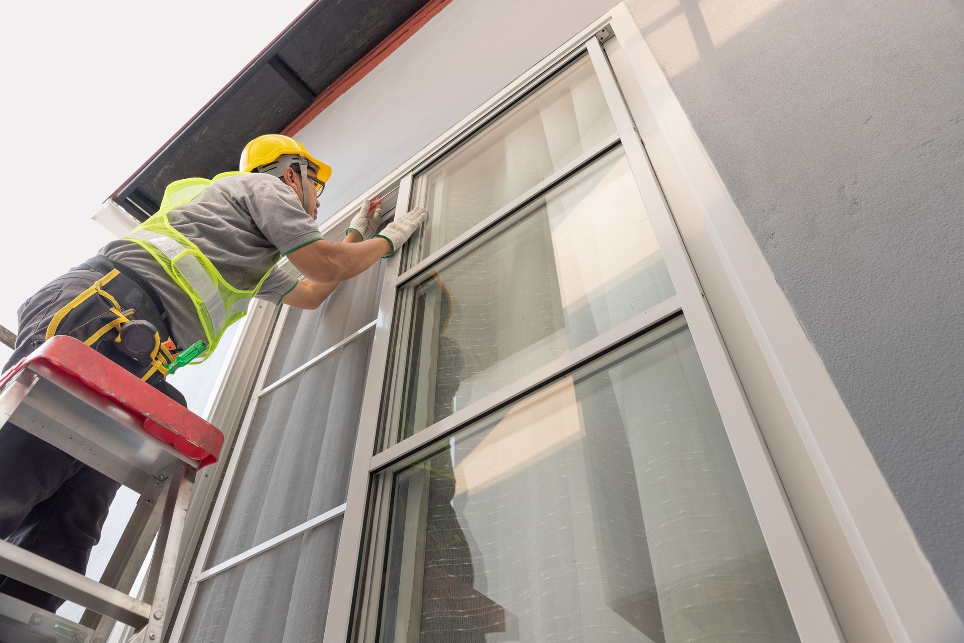 Technician working on a sliding window repair project.