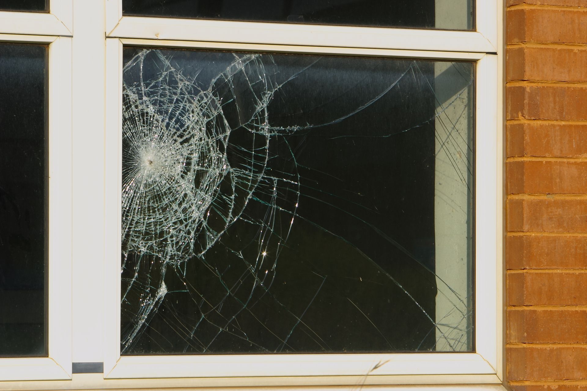 Broken window showing need for window repair by Ken Caryl Glass, Inc., in Colorado Springs, CO