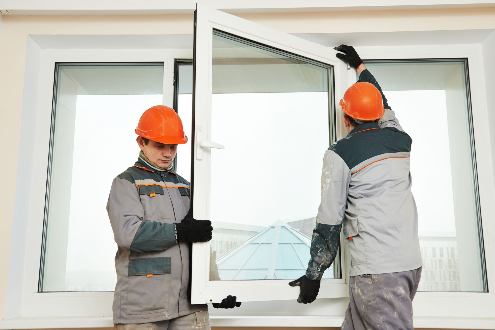 Two workers from Ken Caryl Glass, Inc., performing window replacement in Colorado Springs, CO