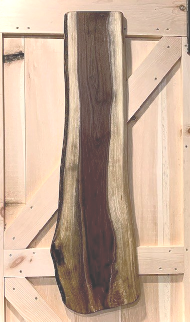Extra large Black Walnut charcuterie board. Custom made in Ontario, Canada. Extra long Walnut grazing board with live edge.