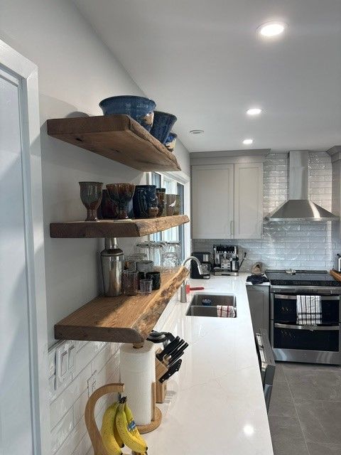 custom kitchen with new floating shelves. Live edge floating in new renovated custom kitchen.