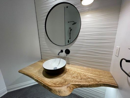 Floating live edge bathroom vanity top.