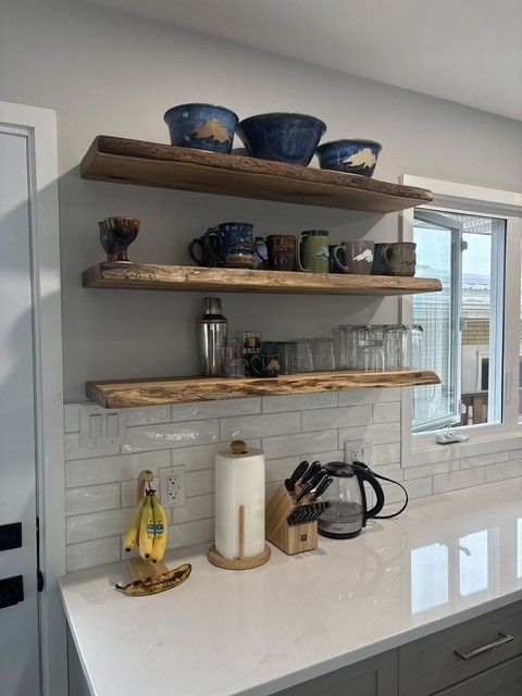 Wood floating shelves for a kitchen renovation. Live edge floating shelf ideas for a new kitchen.