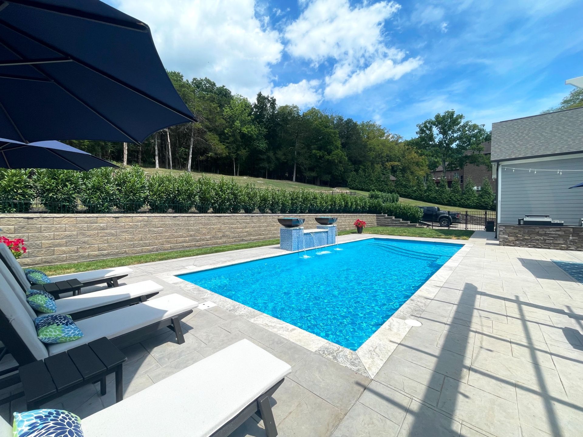 Inground fiberglass pool with fire and water bowls by Majestic Swim in Eagleville, TN