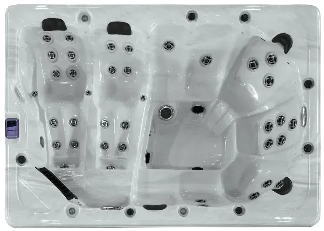 Top-down view of a rectangular white hot tub with molded seating and multiple hydrotherapy jets.