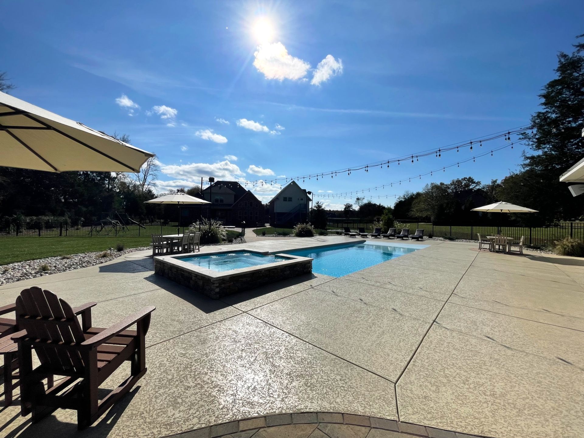 Luxury outdoor seating area beside Grace pool and spa in Murfreesboro TN